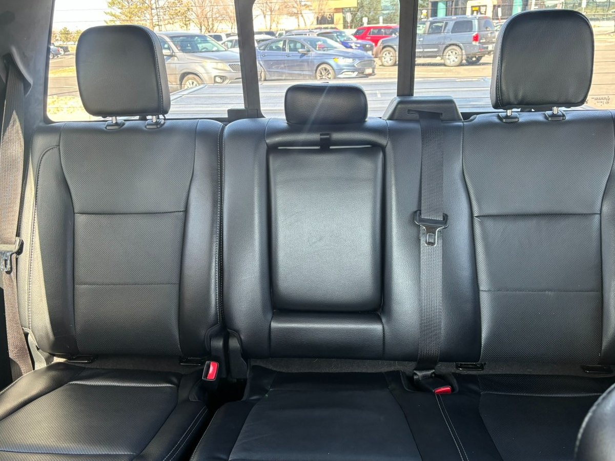Black leather rear bench seats after deep interior cleaning