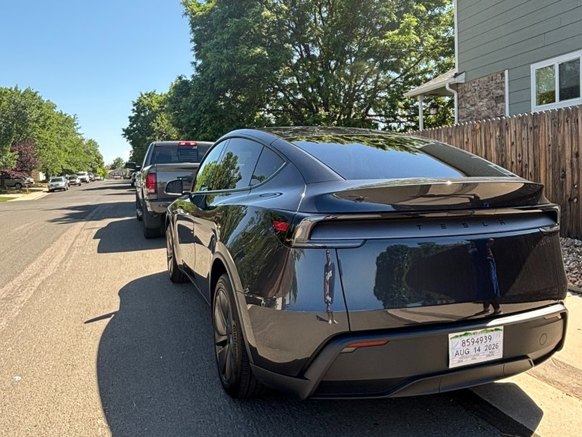 Black Tesla Model Y rear three-quarter after exterior detailing