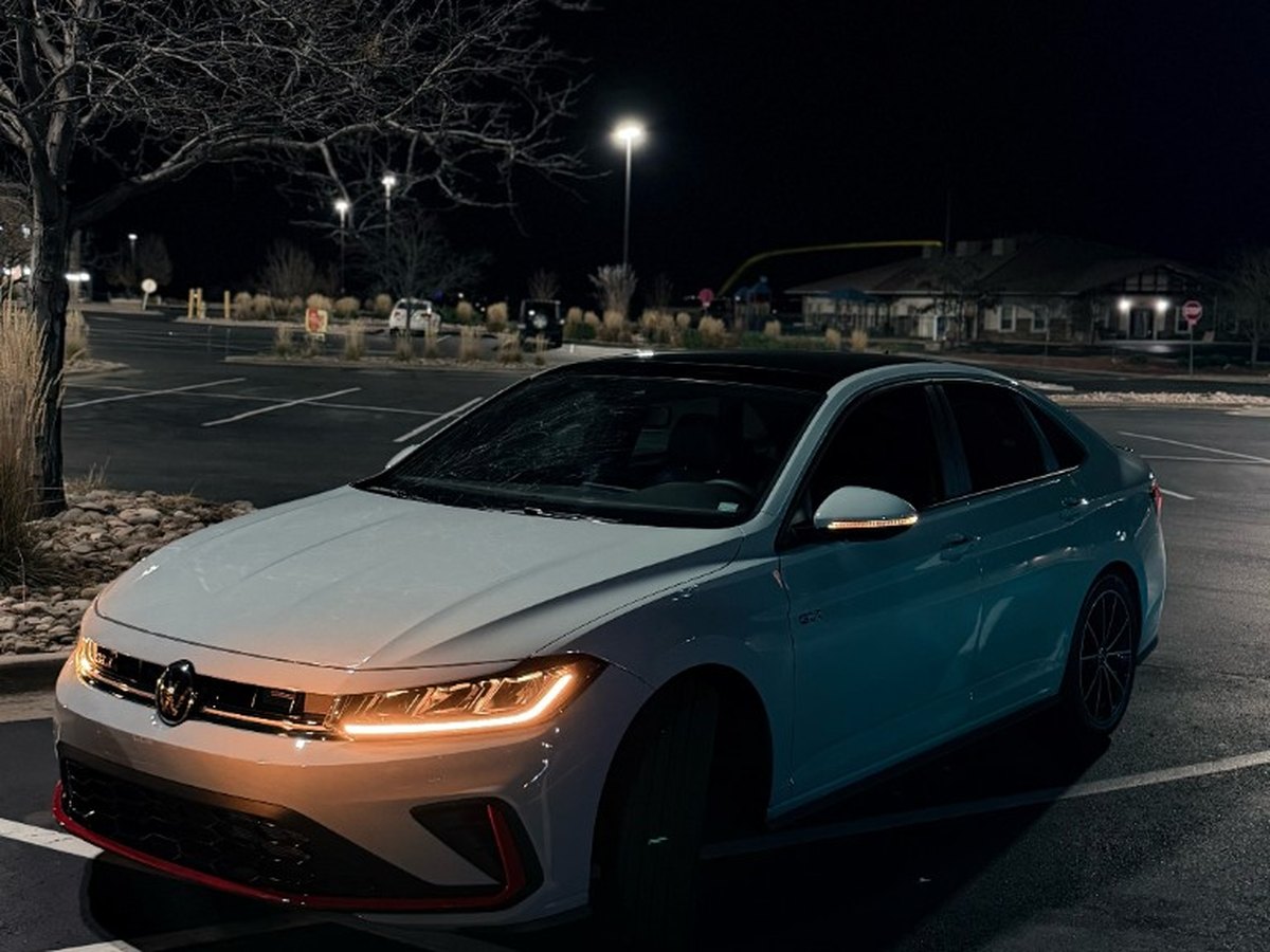 Volkswagen Jetta GLI at night after exterior detailing and polish