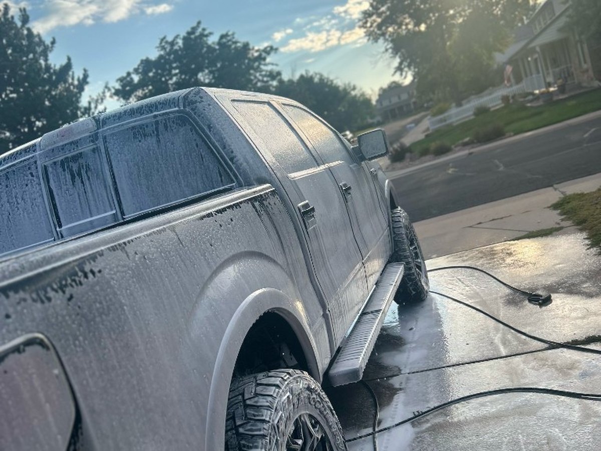 Pickup truck foam wash in progress during mobile exterior detailing