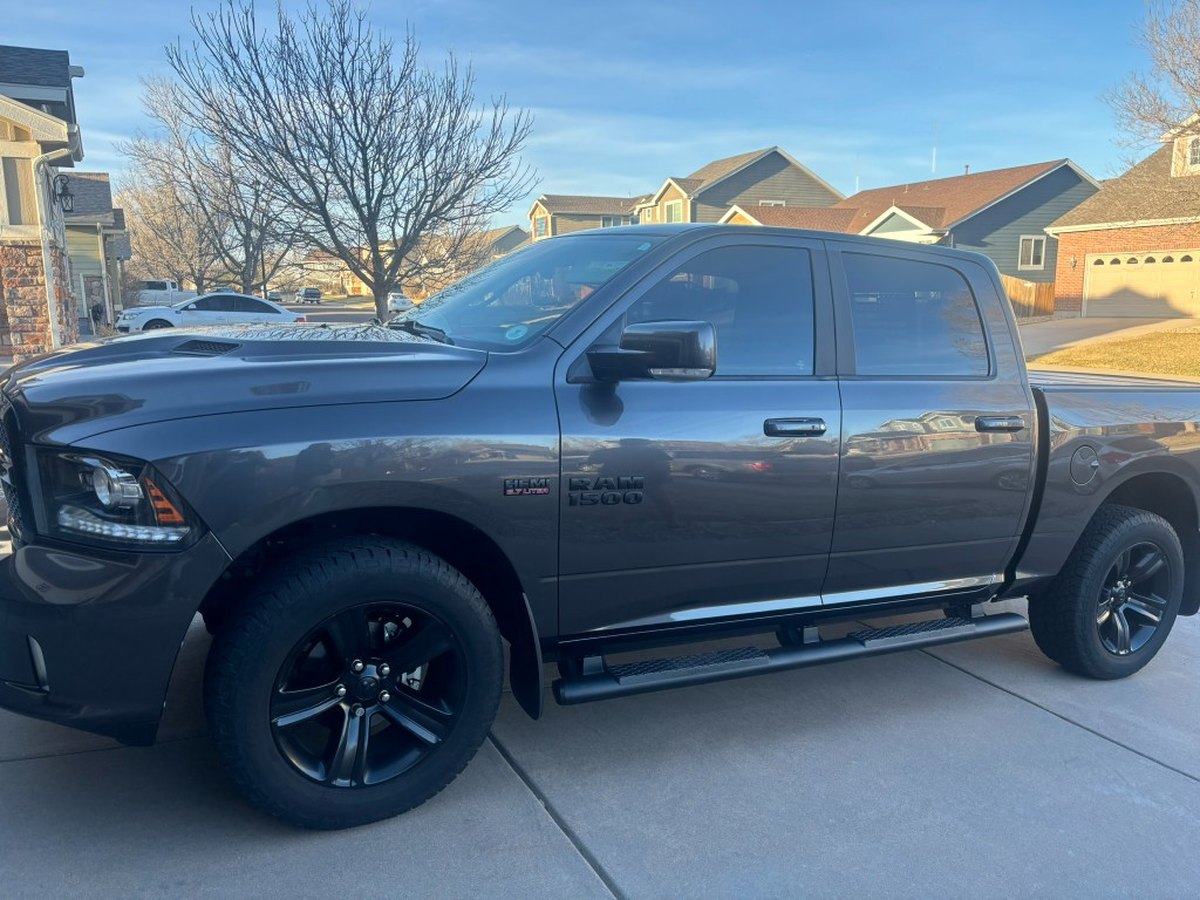 Dark gray Ram 1500 side profile after exterior wash and protection